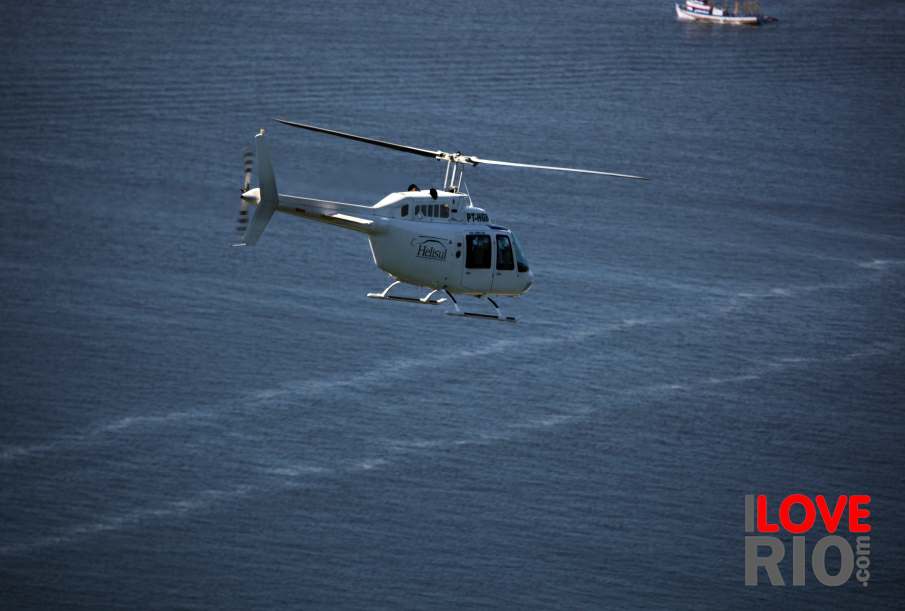 Helicopter flying over the sea.
